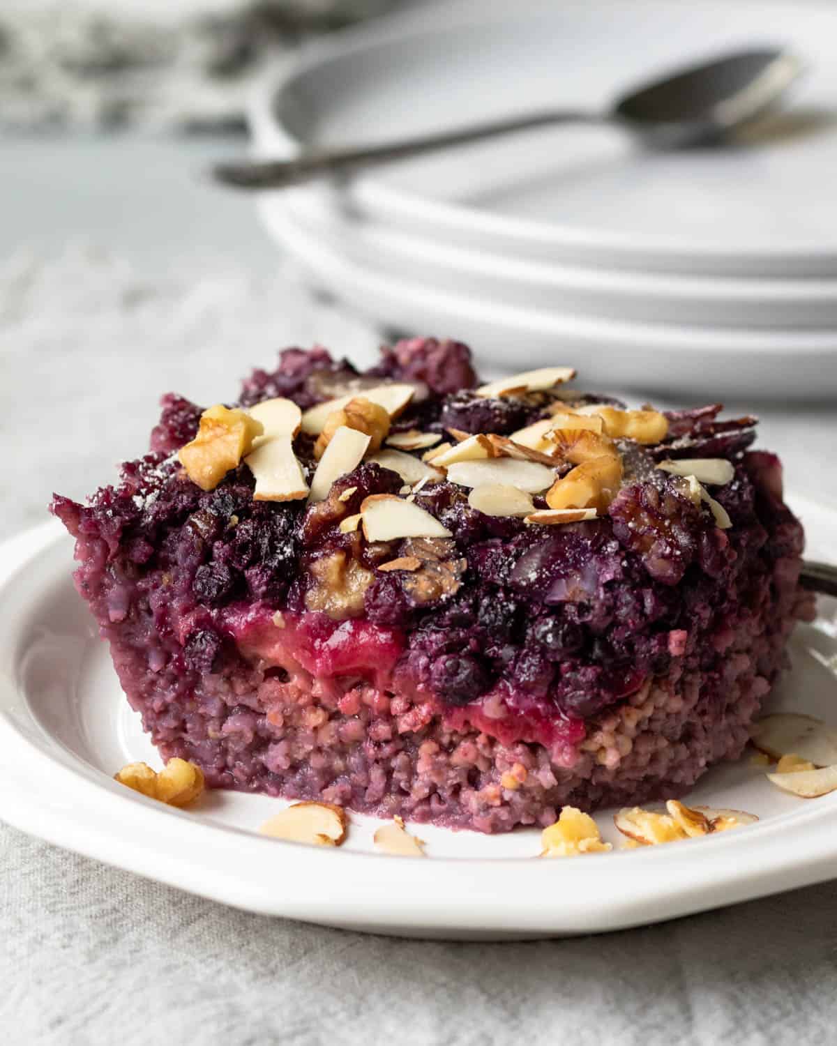 a square slice of millet breakfast bake on a small plate.