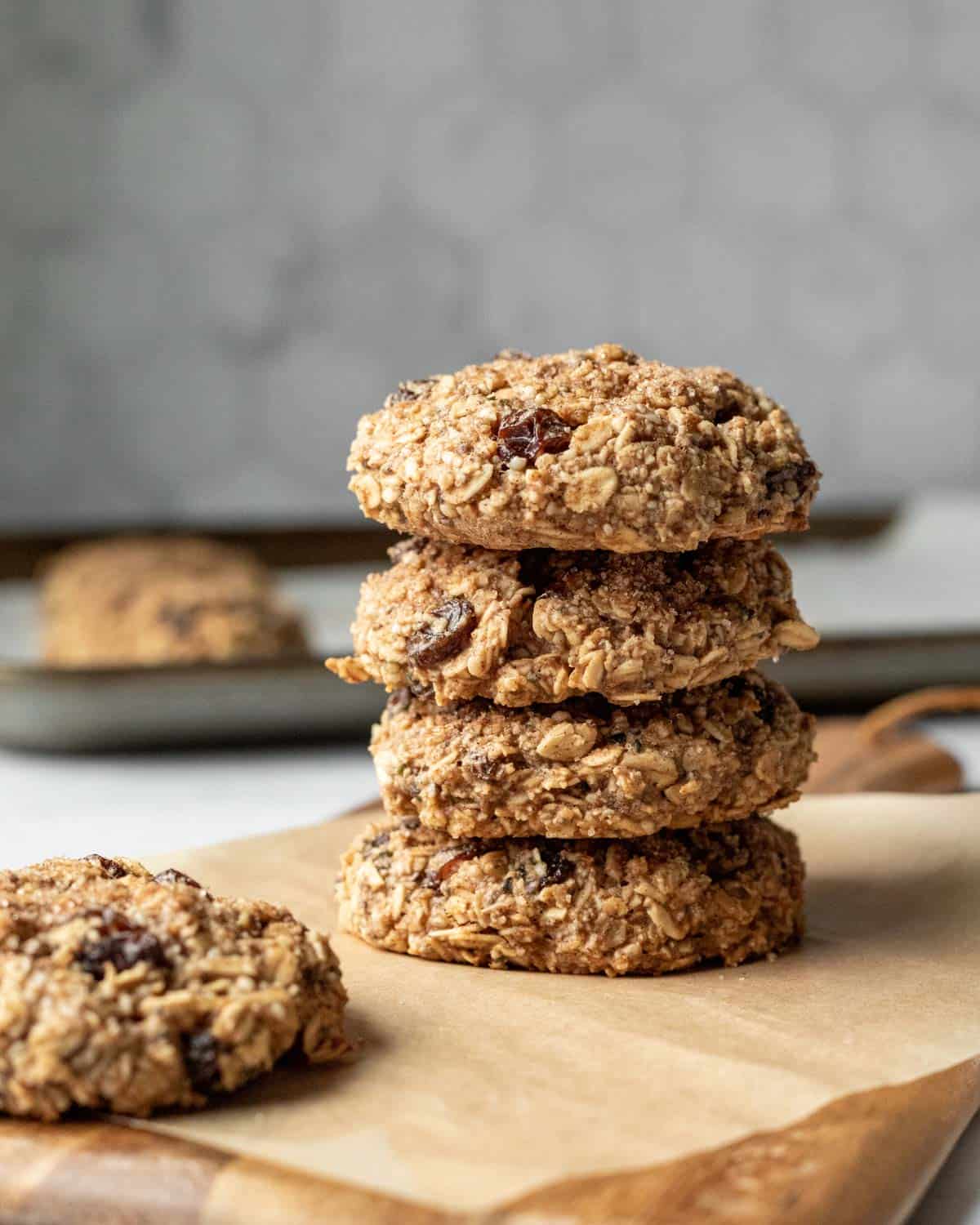 a stack of 4 thick and chewy oatmeal breakfast cookies with raisins.