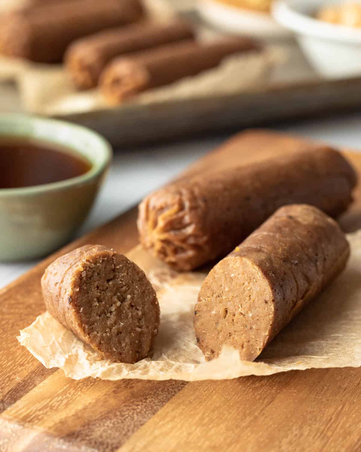 homemade vegan breakfast sausage links on a cutting board.