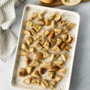 golden and crispy big bagel croutons on a baking sheet.