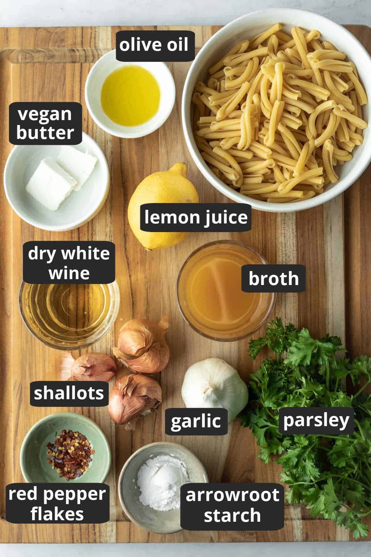 labeled photo of the ingredients needed to make white wine sauce.