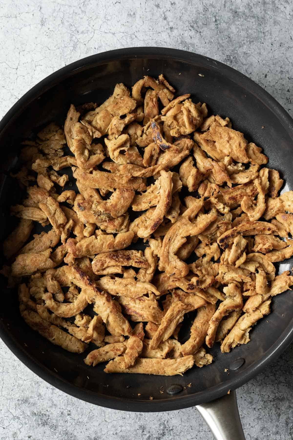 Saute pan filled with Mediterranean soy curls.