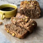 Slices cut from a loaf of homemade banana zucchini bread showing the moist and fluffy texture.