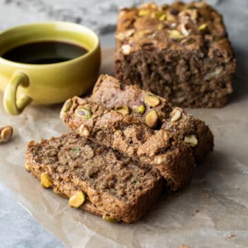 Slices cut from a loaf of homemade banana zucchini bread showing the moist and fluffy texture.