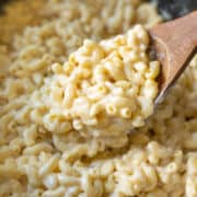 Creamy vegan macaroni and cheese inside a large black Crockpot.