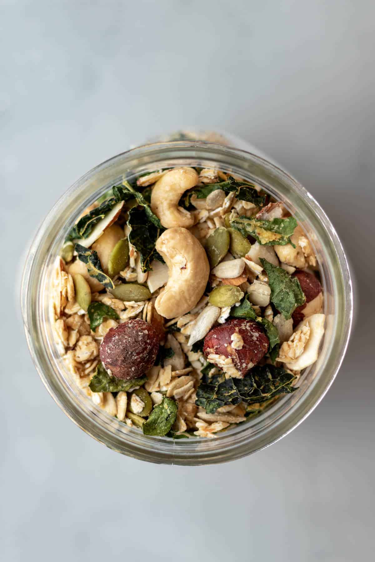 Savory Granola With Rosemary in a glass jar.