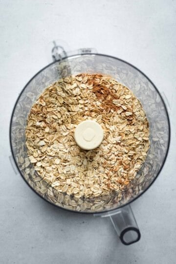 Pulsing oats in a food processor to turn into pie crust.