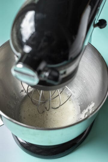 Condensed aquafaba in the bowl of a stand mixer.