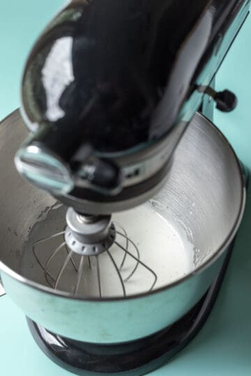 The first stage of whipping aquafaba with an electric mixer.