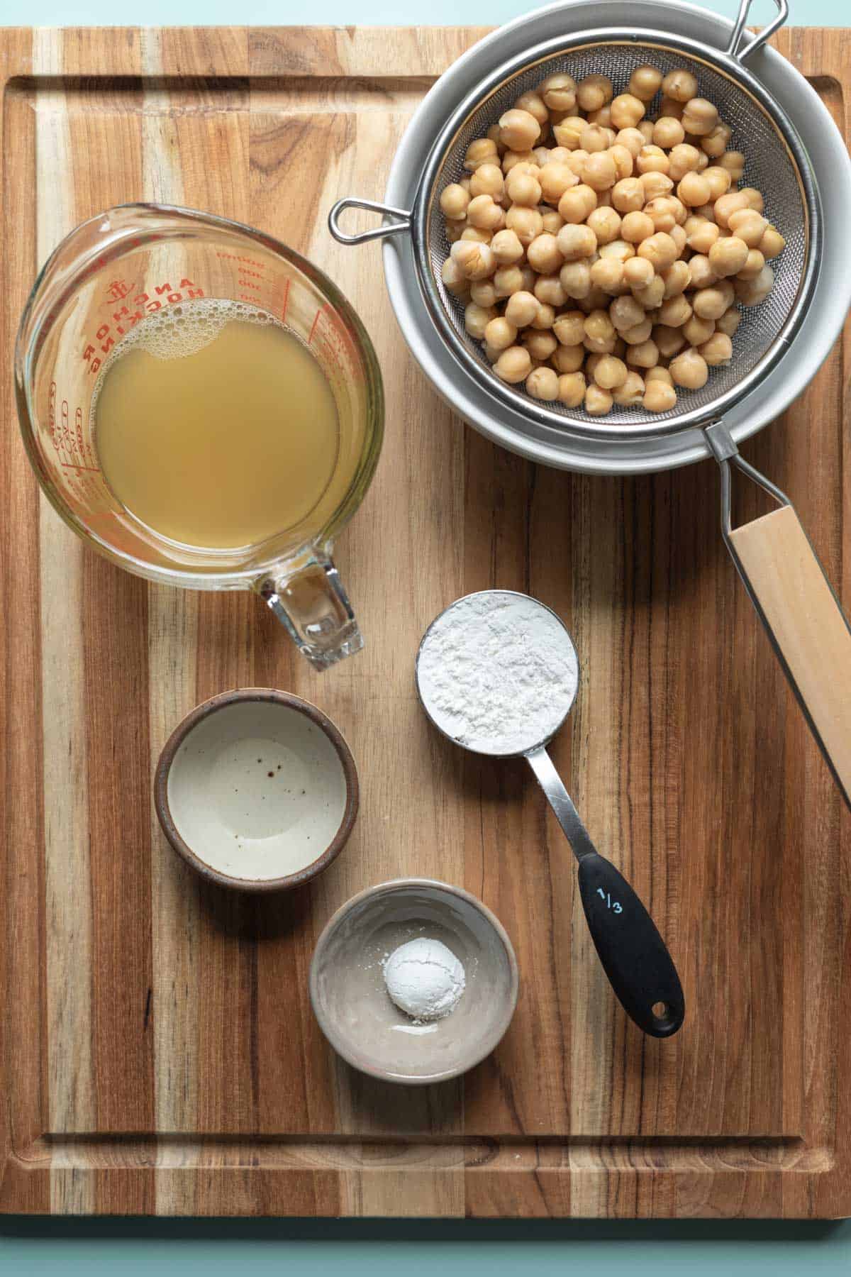 Ingredients needed for the recipe laid out on a wood board.