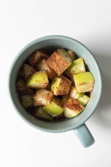 Apple pieces tossed with brown sugar, corn starch, and cinnamon.