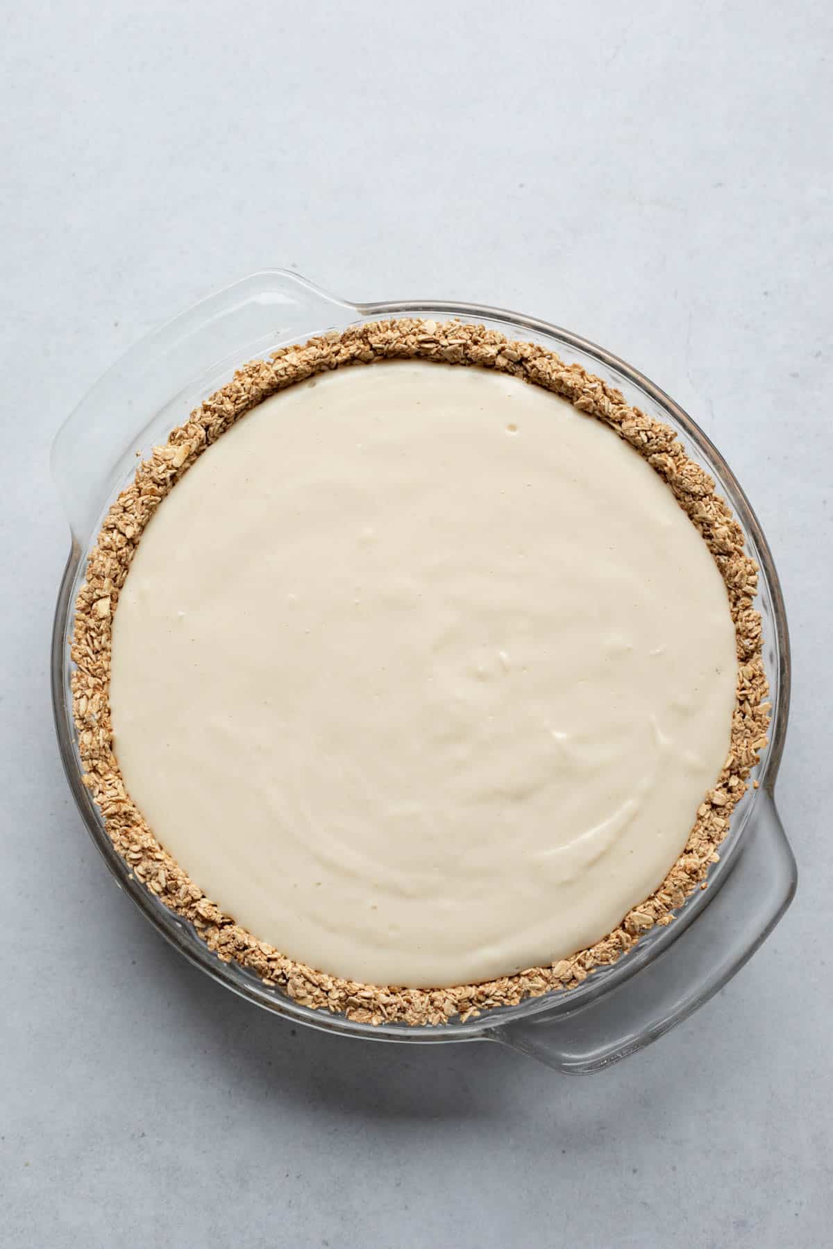 Blended tofu filling poured into a pre-baked oatmeal pie crust.