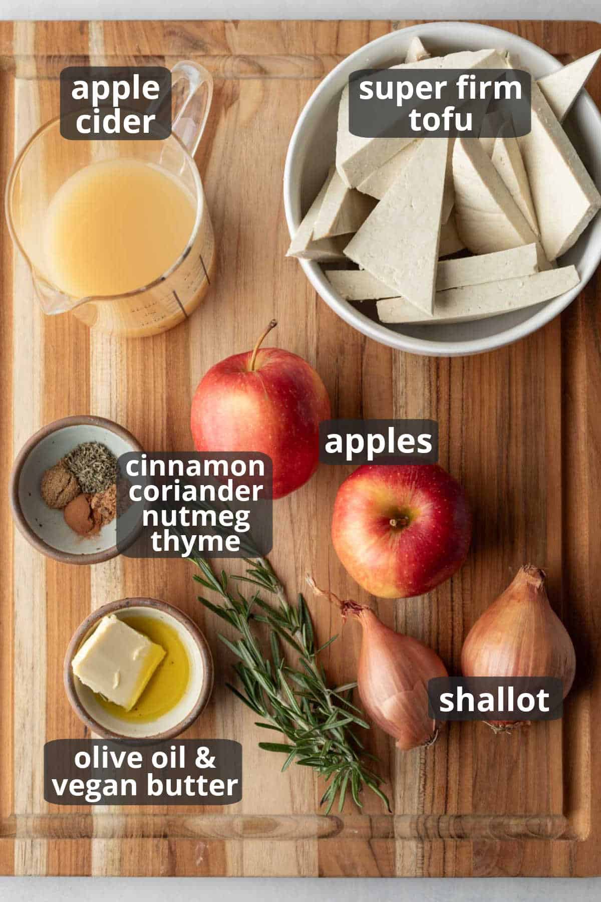A labeled photo of the key ingredients needed to make skillet apple cider tofu.