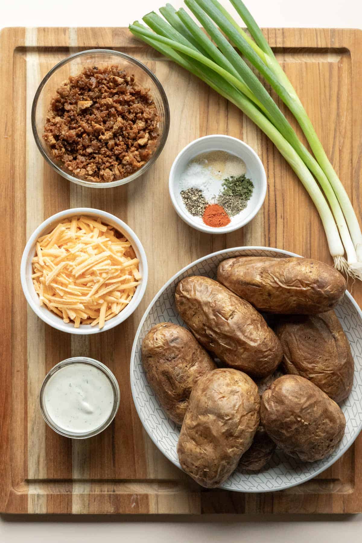 The four main ingredients needed for potato skins plus a few seasonings.