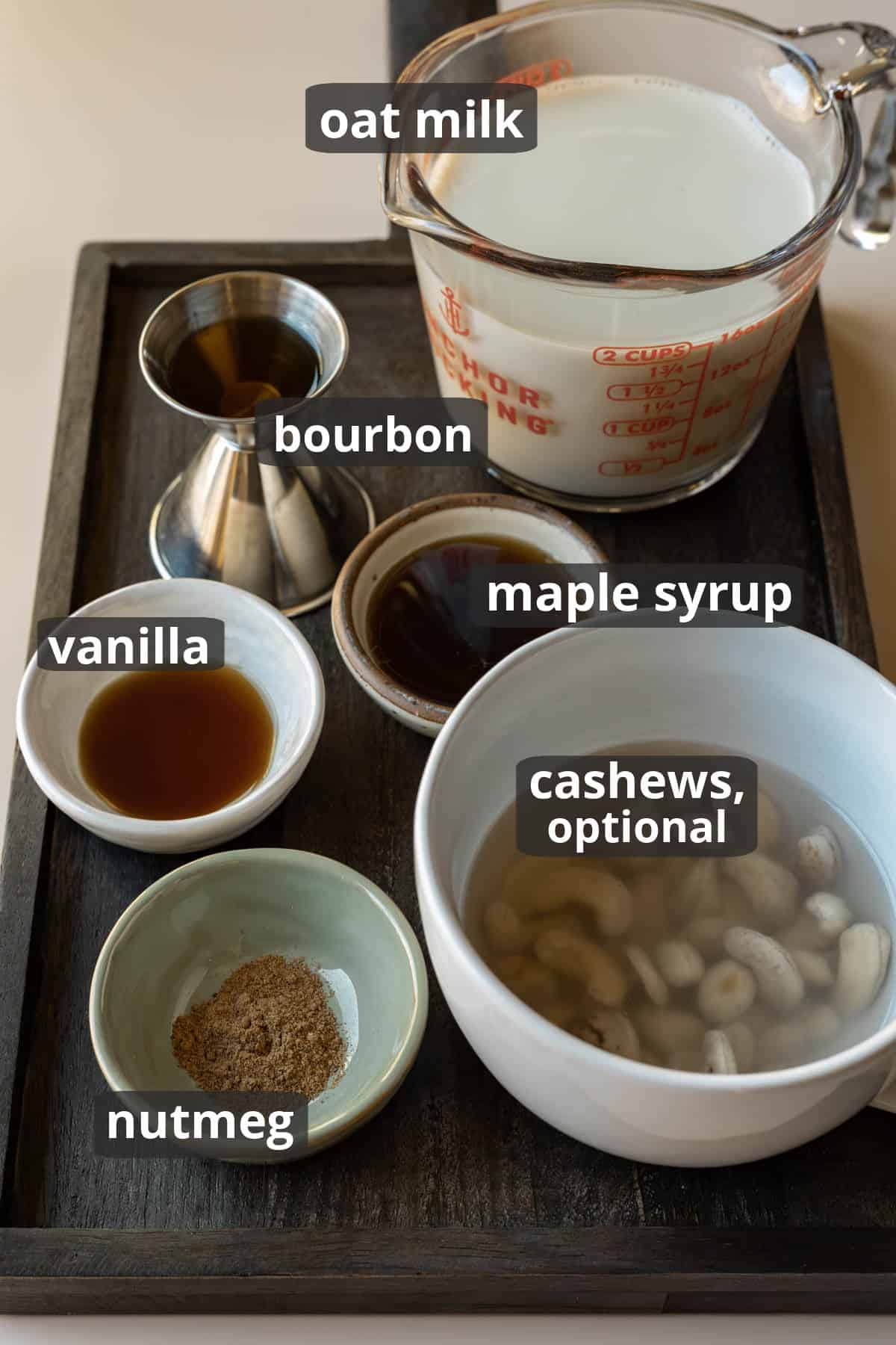 Labeled photo of the ingredients needed for oat milk eggnog.