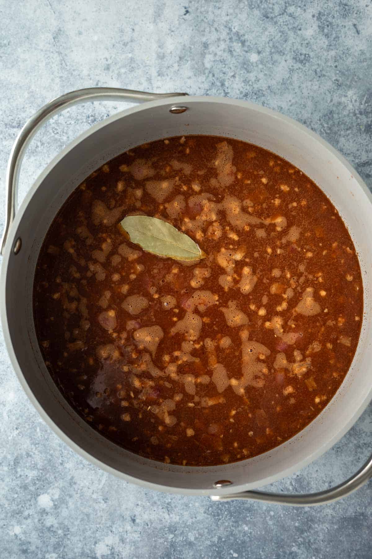 overhead view of ingredients for vegan Cincinnati chili in a soup pot.