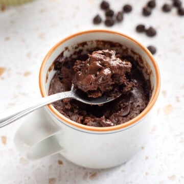 Spooning up a bite of chocolate mug brownie.