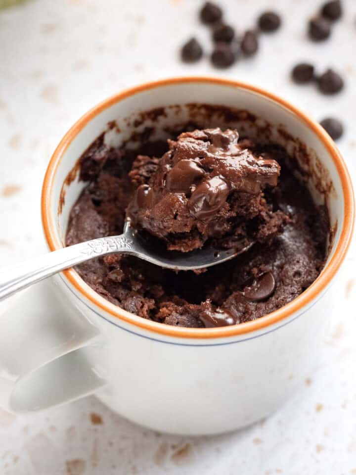 Spooning up a bite of chocolate mug brownie.