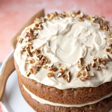 Almond flour frosting on a two-layer vegan carrot cake.