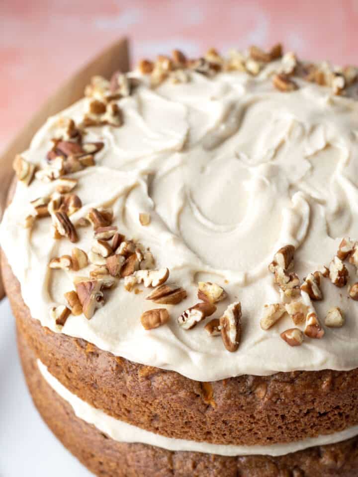 Almond flour frosting on a two-layer vegan carrot cake.