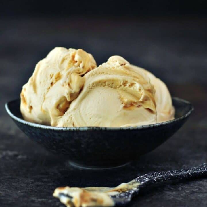 ginger maple miso ice cream in a bowl with a spoon in front of it.