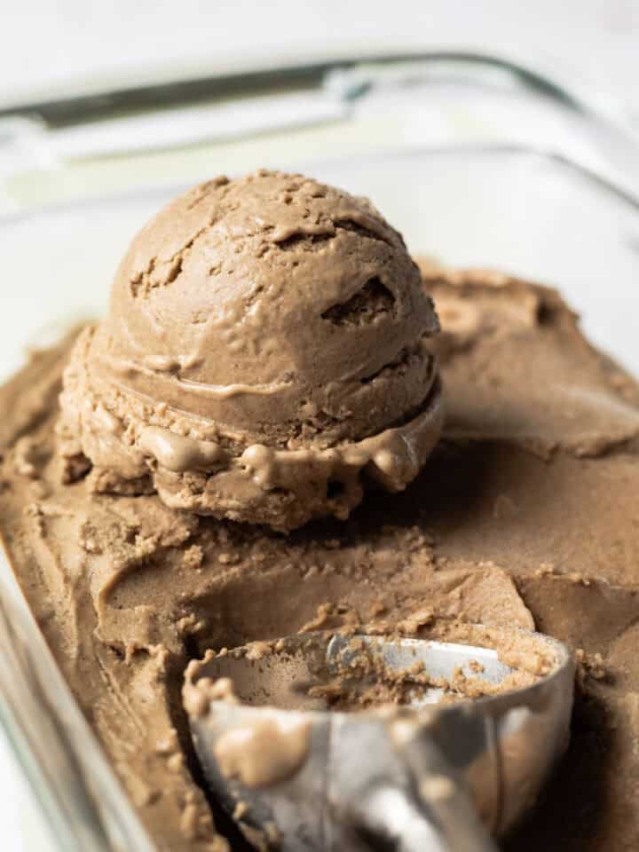 Close up of a scoop of vegan date ice cream made with sunflower seeds.