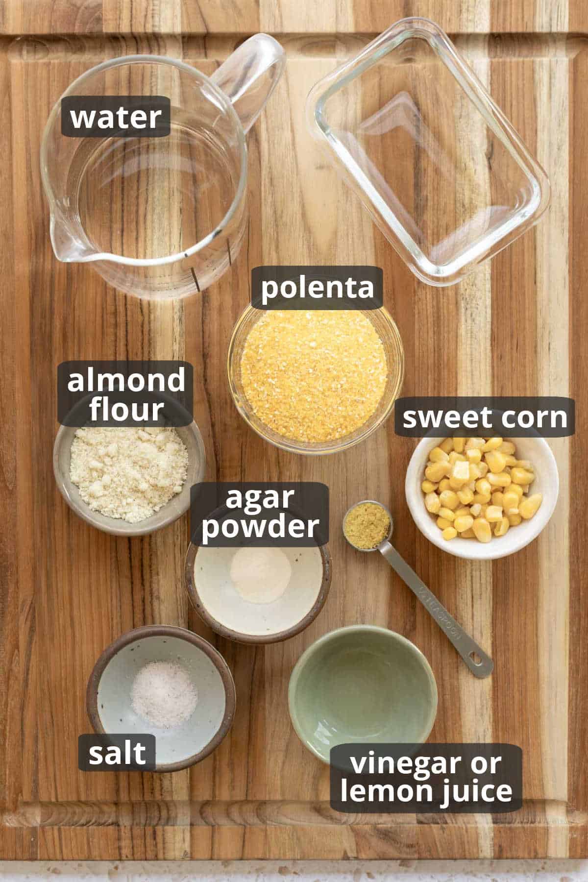 overhead shot of ingredients for low fat butter substitute on a wooden board.