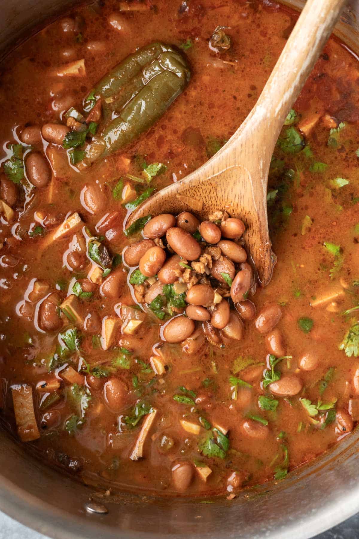 Chopped cilantro is stirred into the finished bean stew.