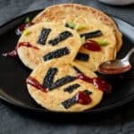 Savory tofu pancakes drizzled with spicy ketchup sauce.