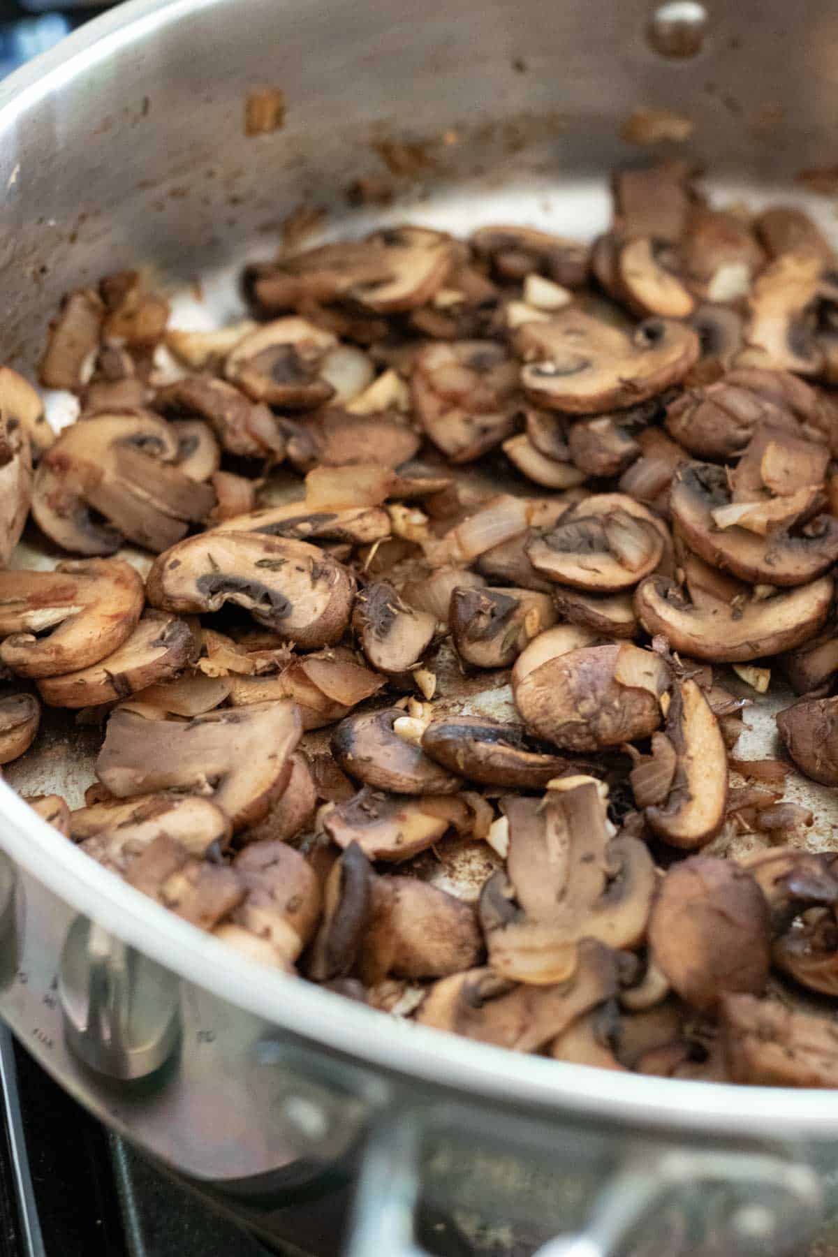 Sauteing mushrooms until dry.