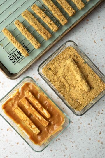 coating the tofu with the batter and then the breading.