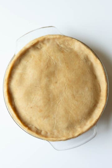 Showing the unbaked pie with the top crust in place.