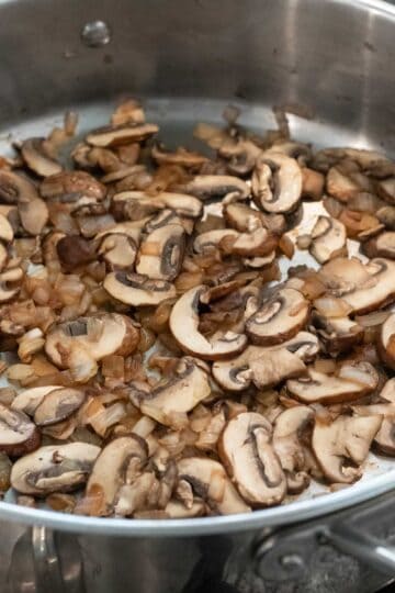 Sauteing onion and mushrooms for gravy.