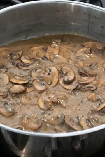 Thick and creamy mushroom gravy in the pan, ready to be served.