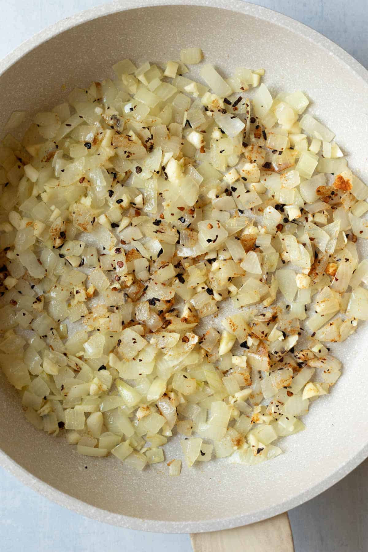 Sauteing onion, garlic, and spices for pumpkin pasta sauce.