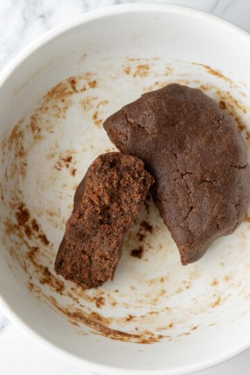 Gingerbread cookie dough in a white mixing bowl.