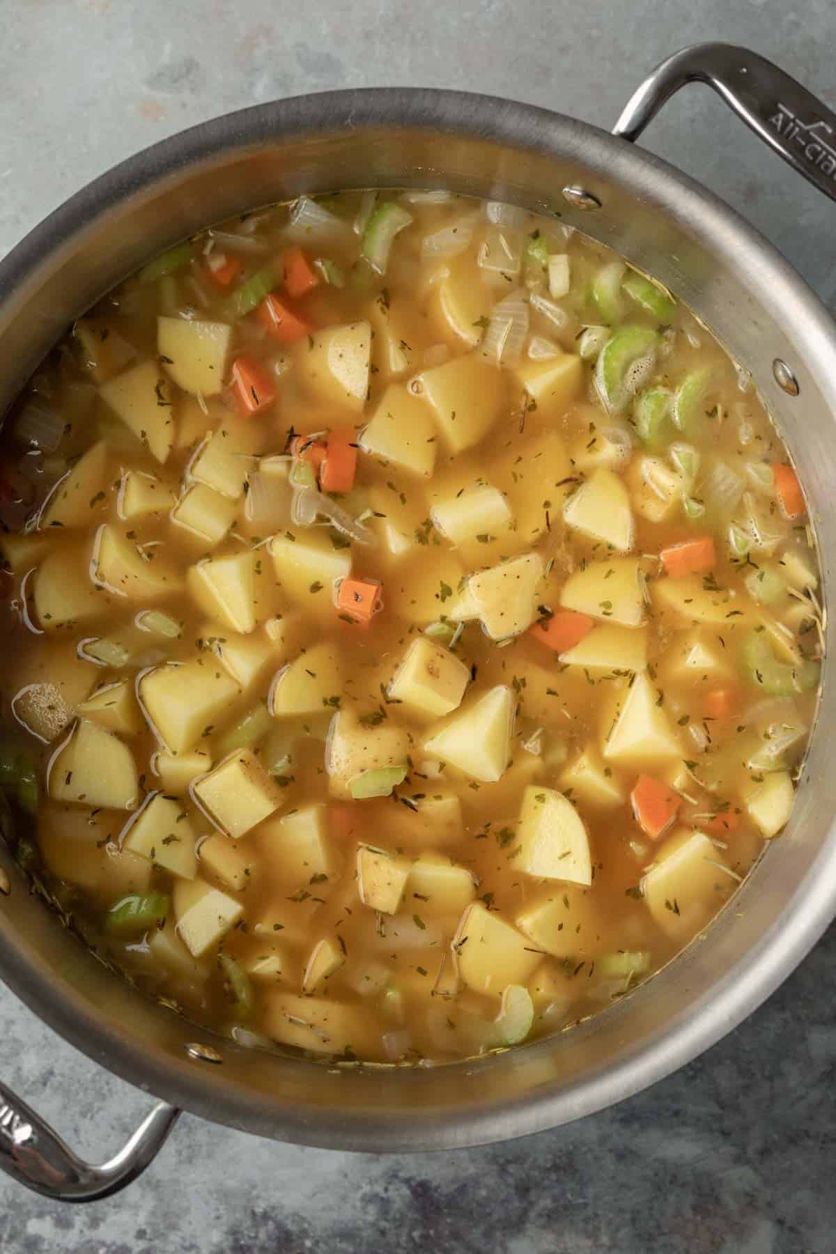 Potato soup cooking in a pot.