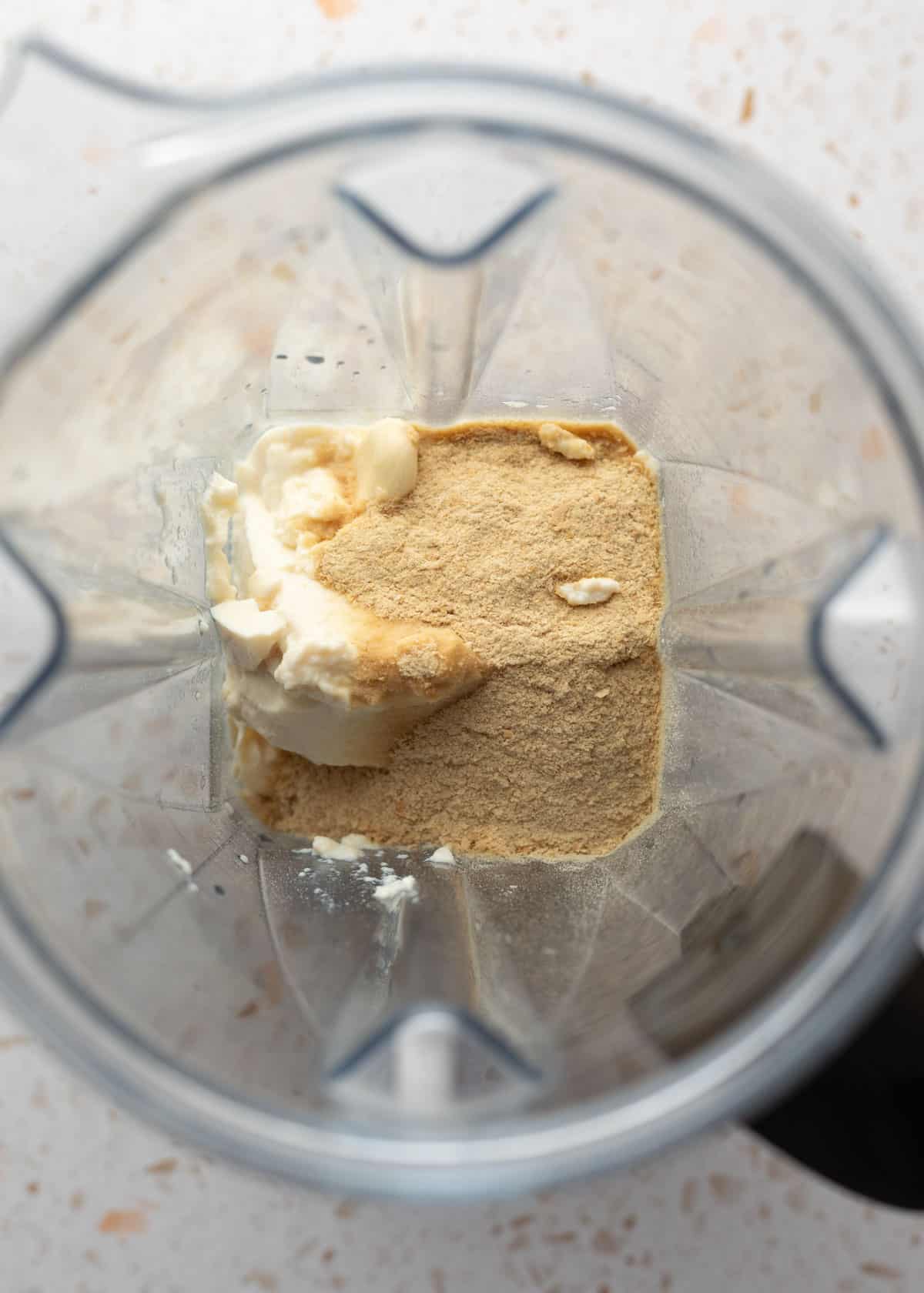 Looking at the sauce ingredients inside a blender jar.