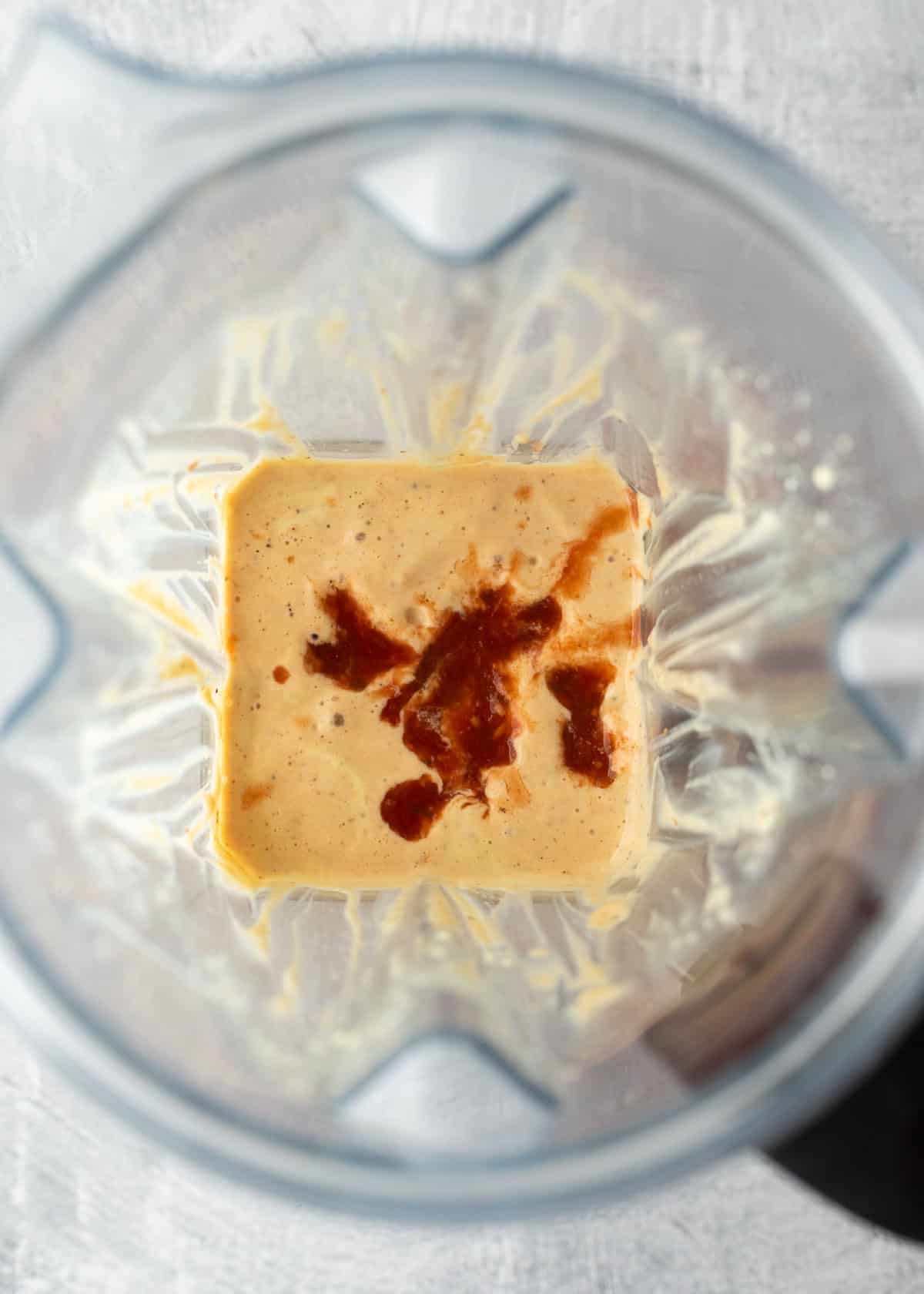 Ingredients for tofu queso in a blender before blending.