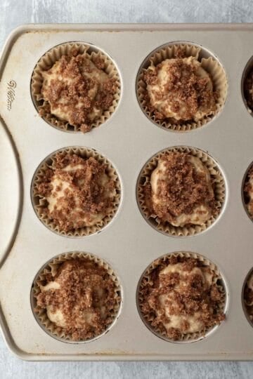 Streusel topping added to each muffin cup before baking.