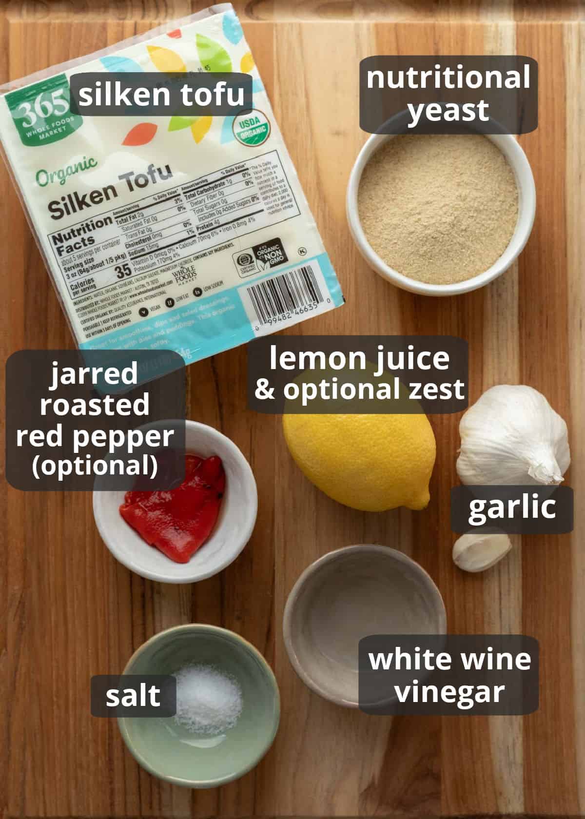 A labeled photo of the 7 ingredients needed to make silken tofu pasta sauce.