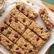 Buckwheat bars with pumpkin seeds and dried cranberries pressed into the tops.