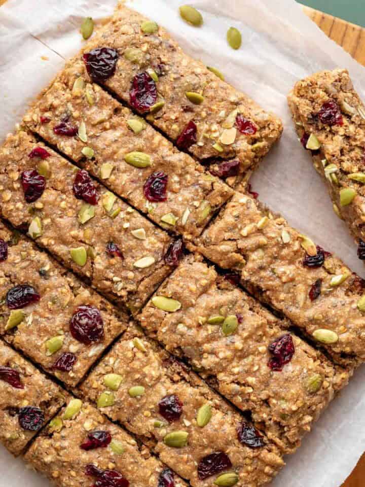 Buckwheat bars with pumpkin seeds and dried cranberries pressed into the tops.