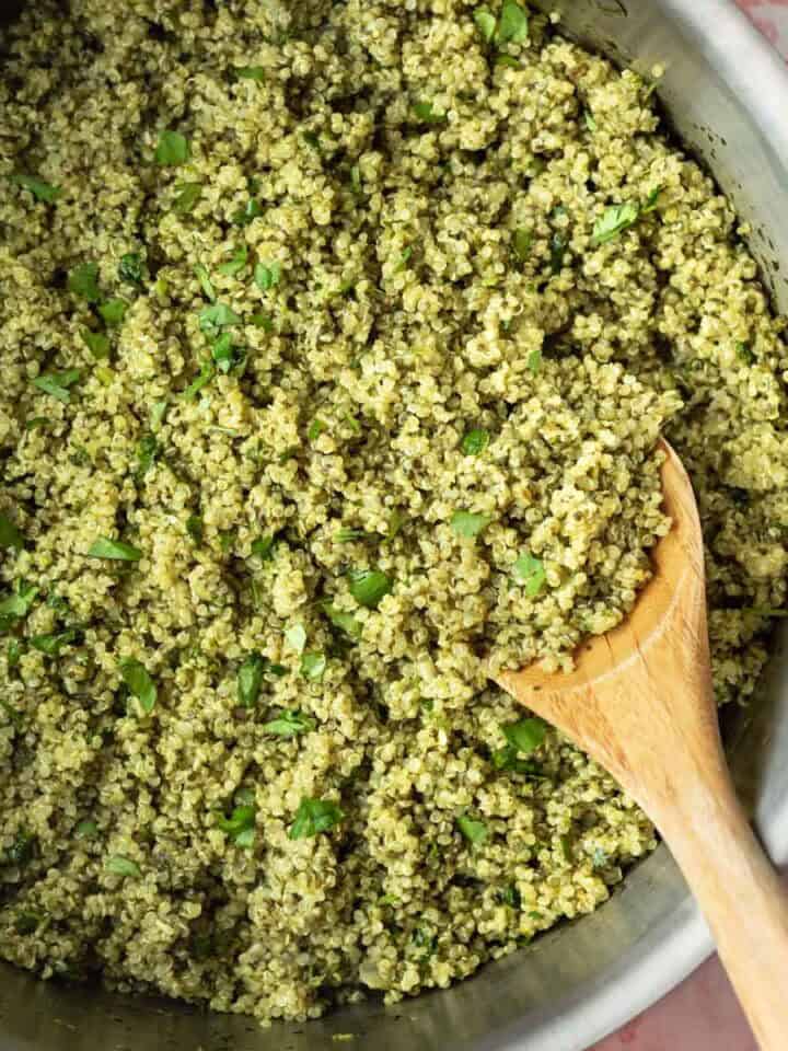 A large pot full of green quinoa made with spinach and cilantro.