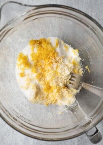 Lemon zest and sugar in a mixing bowl.