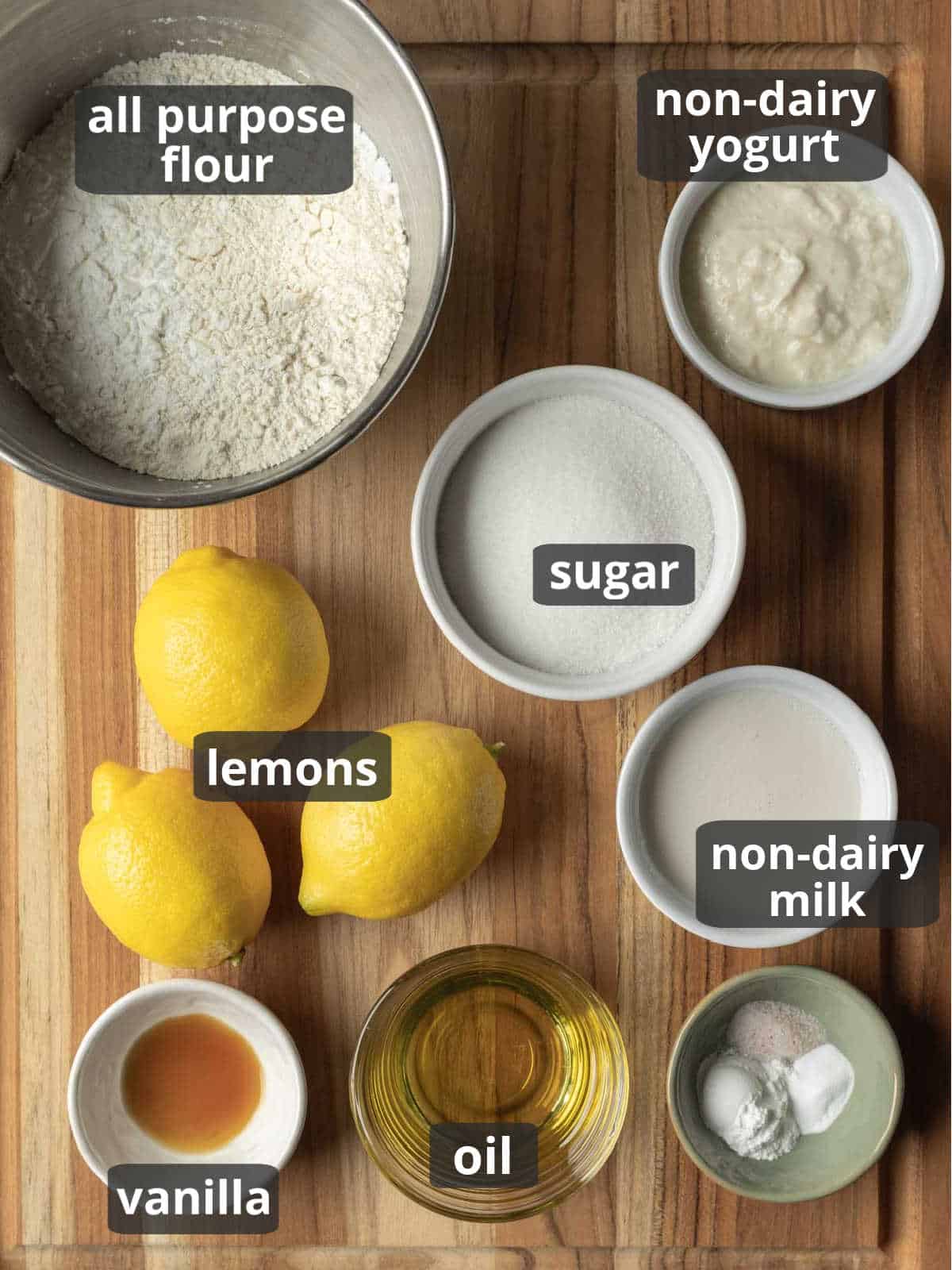 Labeled photo of the ingredients needed to make lemon cake from scratch.