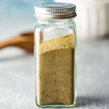 A small spice jar filled with homemade poultry seasoning.