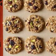 Baked applesauce oatmeal cookies on a silicone baking mat.