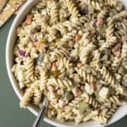 Creamy dill pickle pasta salad in a large serving bowl.