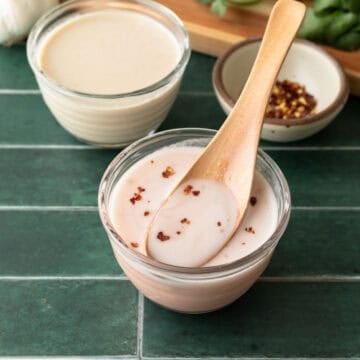 Two versions of ume plum vinegar dressing in small glass bowls.